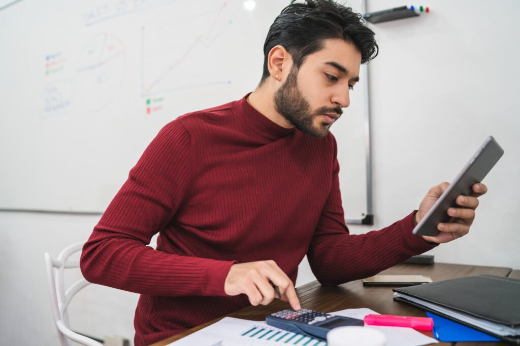 young creative man working with his digital tablet.