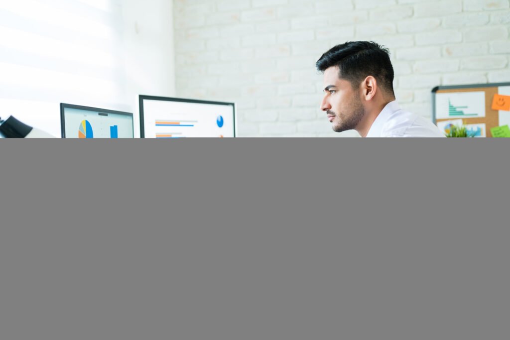 freelance salesman examining data at desk